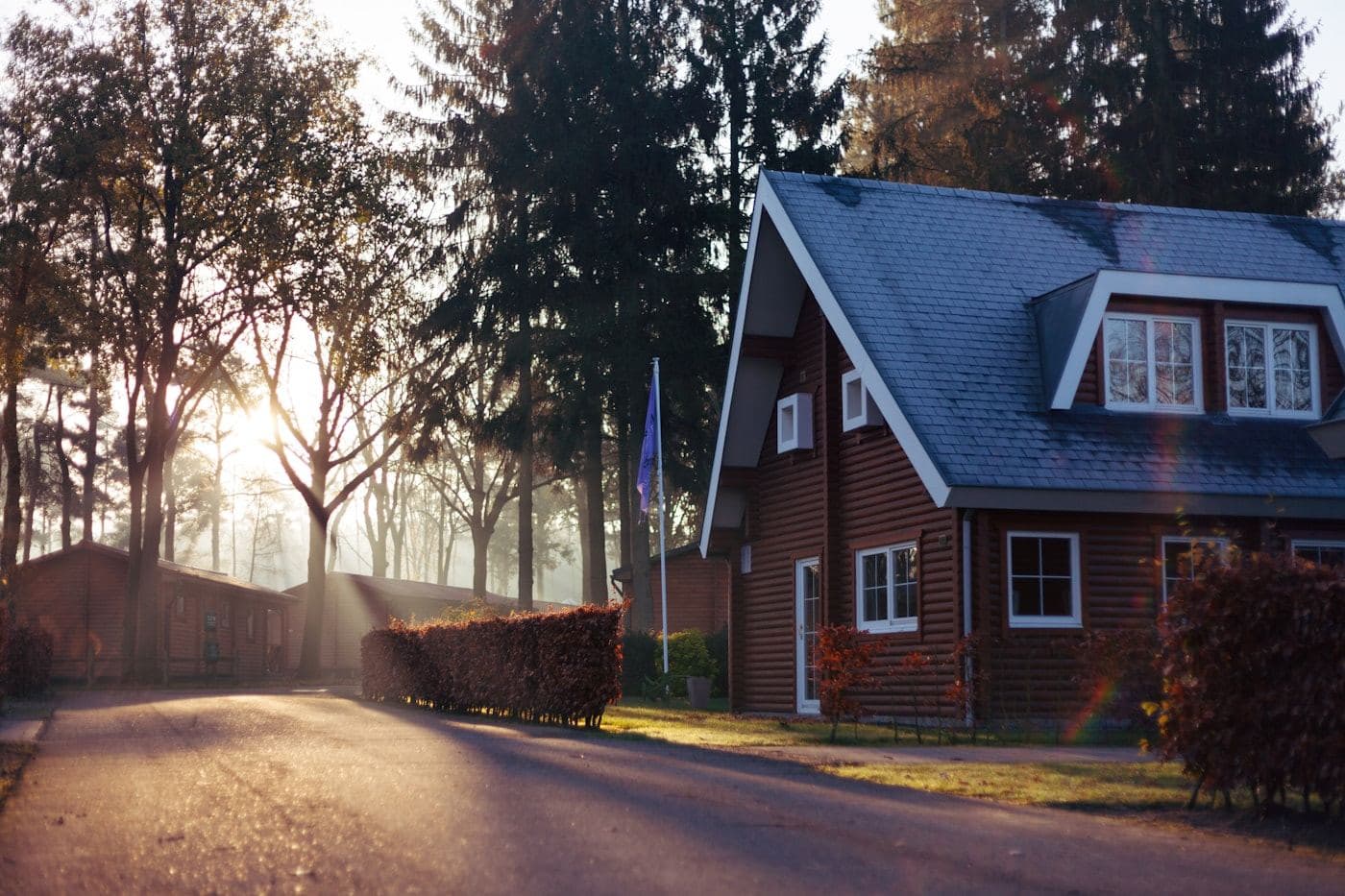 Cottage exterior with a pitched roof and front lawn