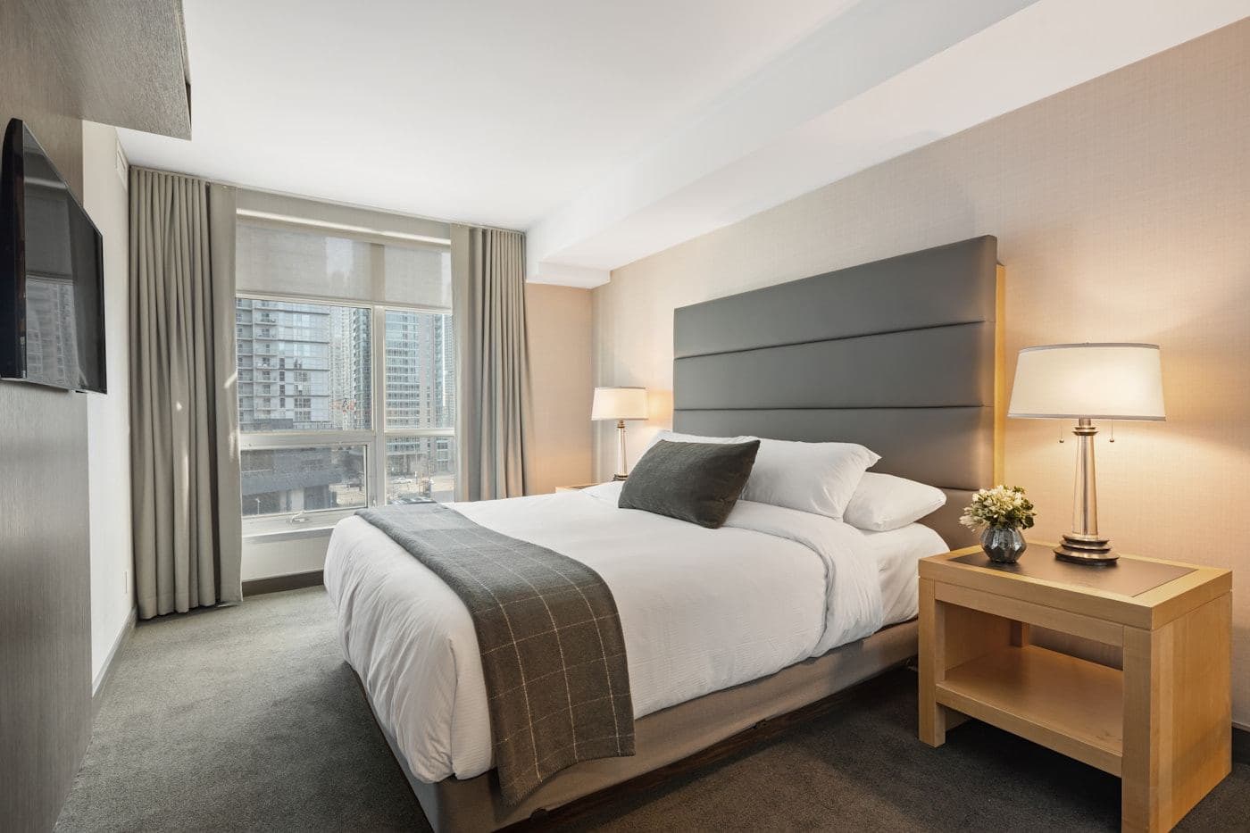 Grand suite bedroom with an ocean-facing window