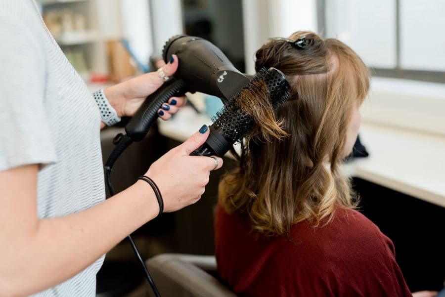 Colourist applying foils to a client's hair