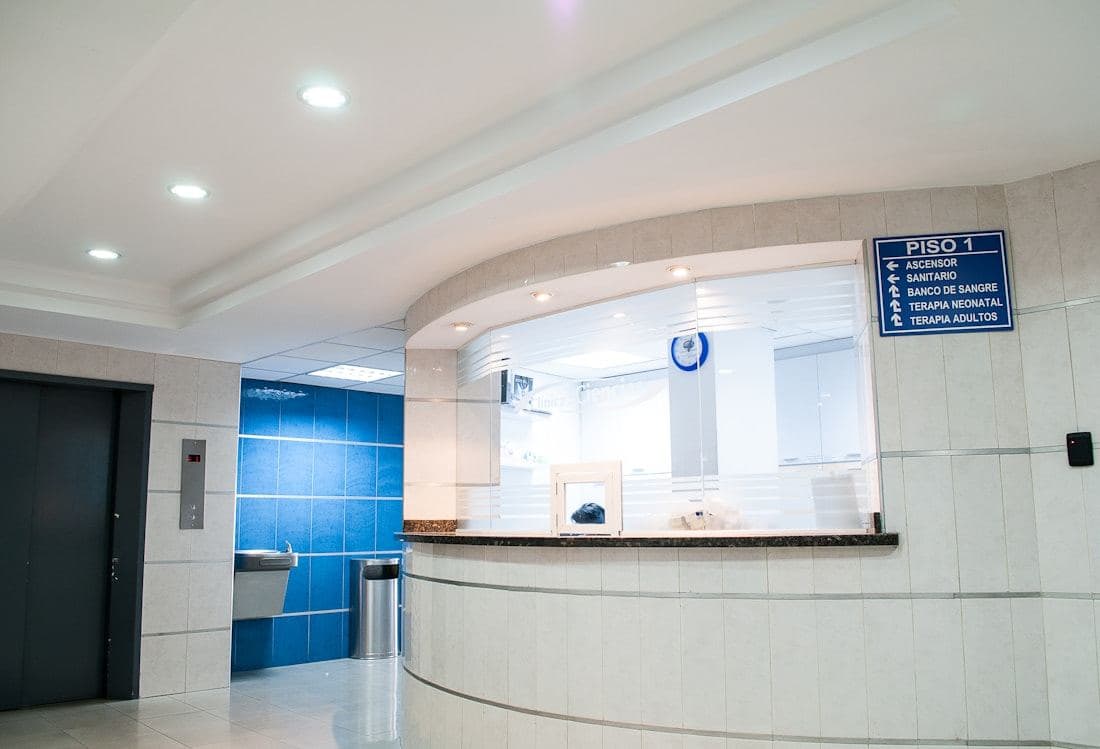 Clinic reception desk in a bright waiting area