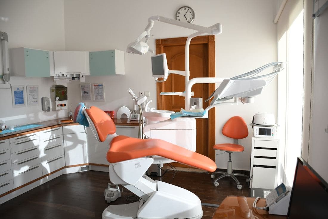 Dental surgery room with an orange treatment chair