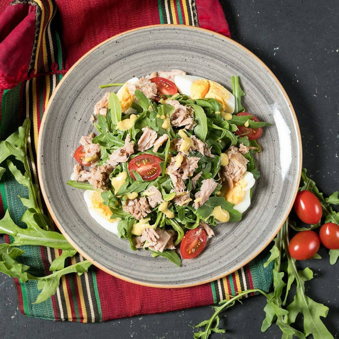 Fresh salad bowl with grilled protein, greens and tomatoes
